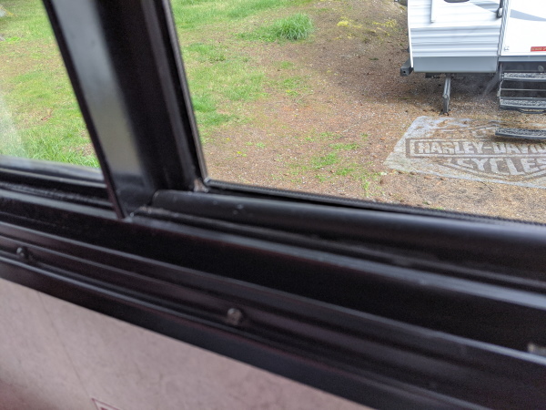 1/2 inch dowel against slider framing to show how it can't open